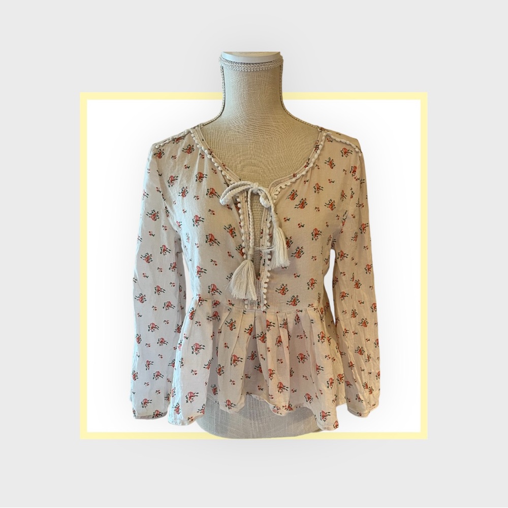 Joe’s floral long sleeve shirt with with trim and tassel detailing .  Cream